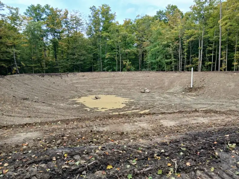 After: the same style of lot cleared and rough-graded, ready for house construction